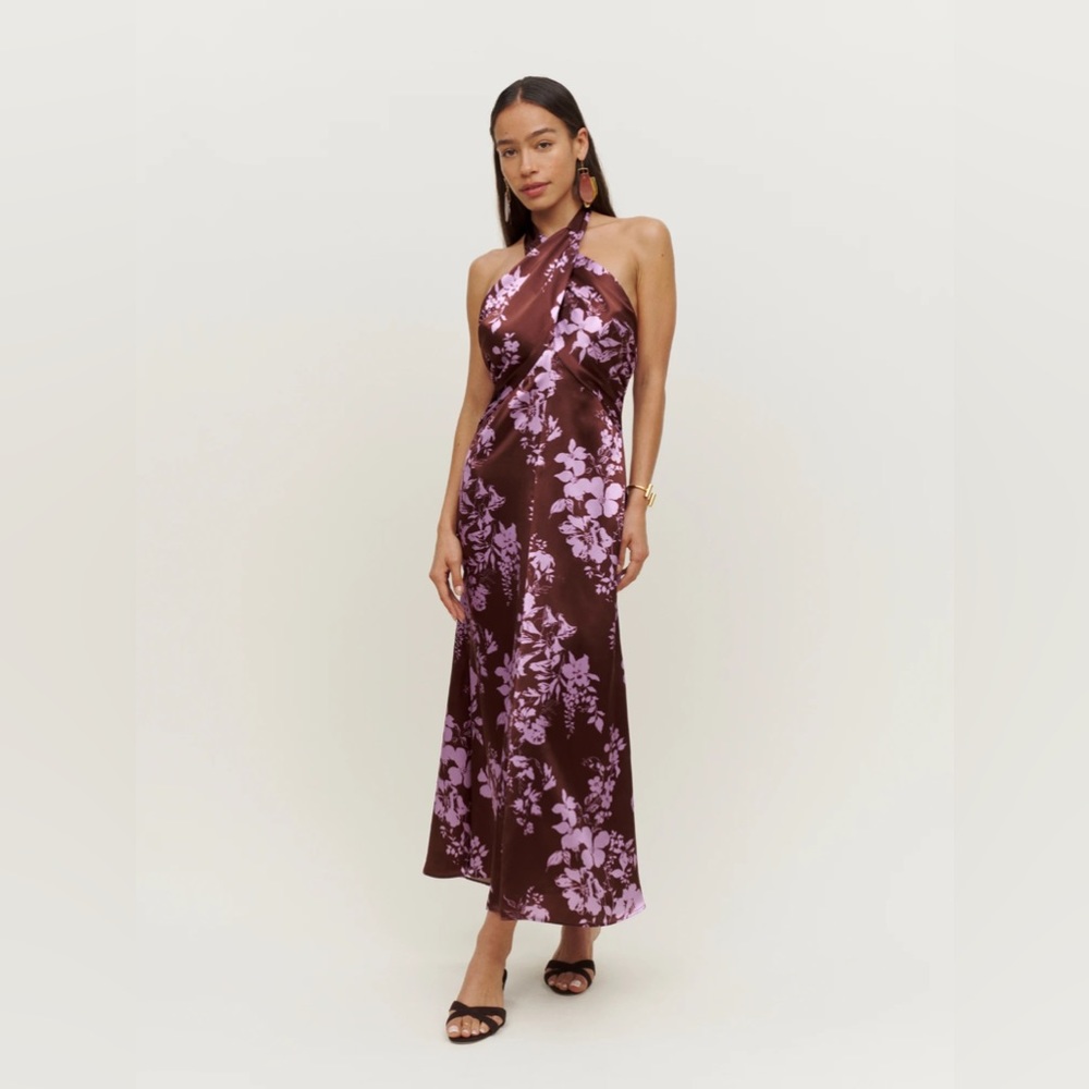The Maddison is a sleeveless, midi dress with an adjustable halter neckline